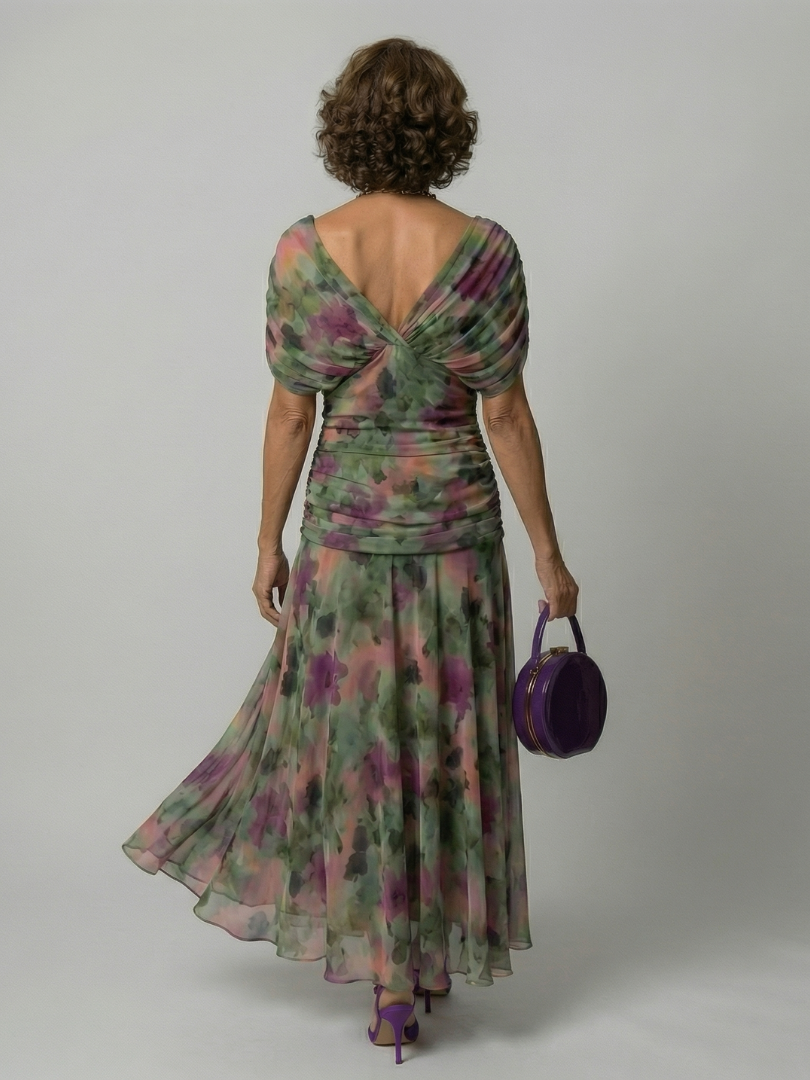 Off-shoulder flowy midi dress, close-up of the hem