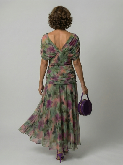Off-shoulder flowy midi dress, close-up of the hem