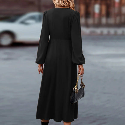 Long sleeve pleated midi dress, angled front view